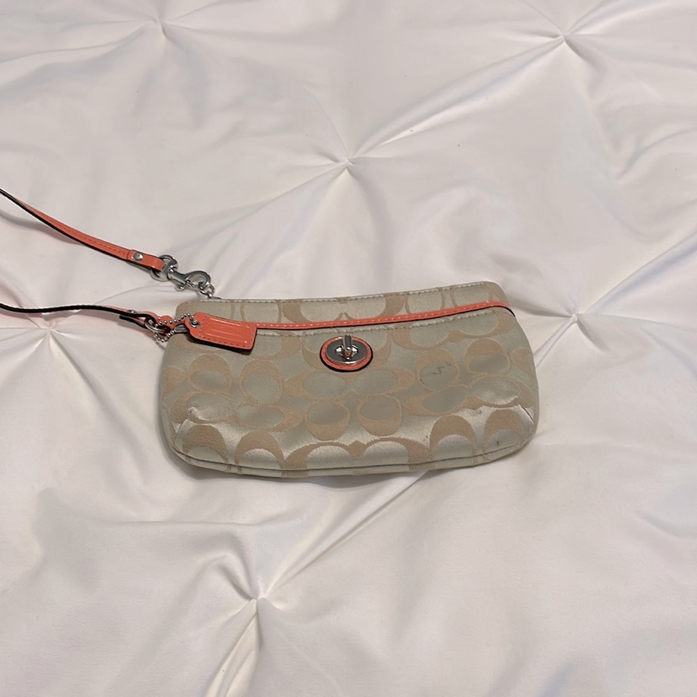 Coach wristlet tan with peach hand strap